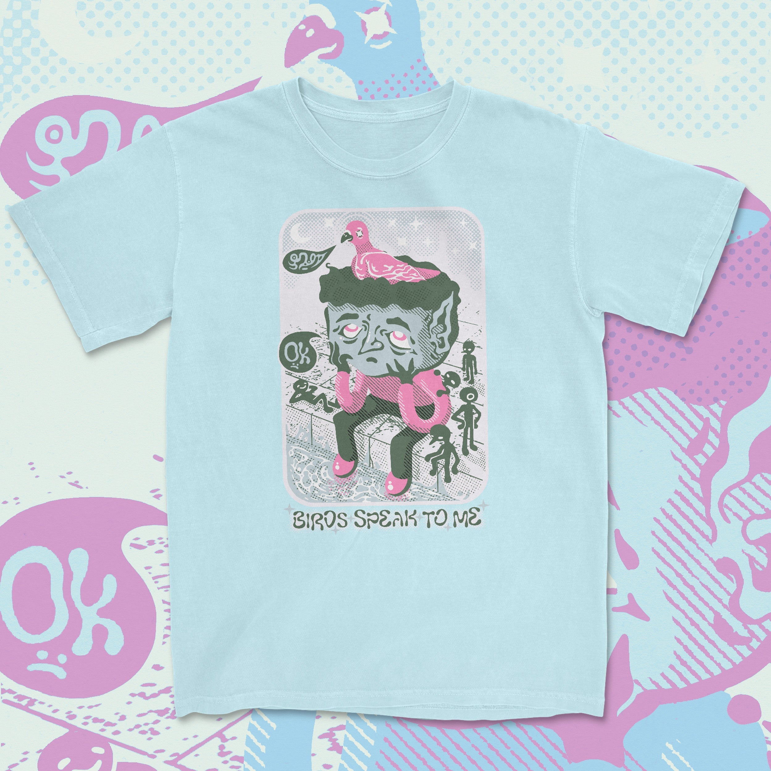 Light blue t-shirt with graphic design on a colorful background