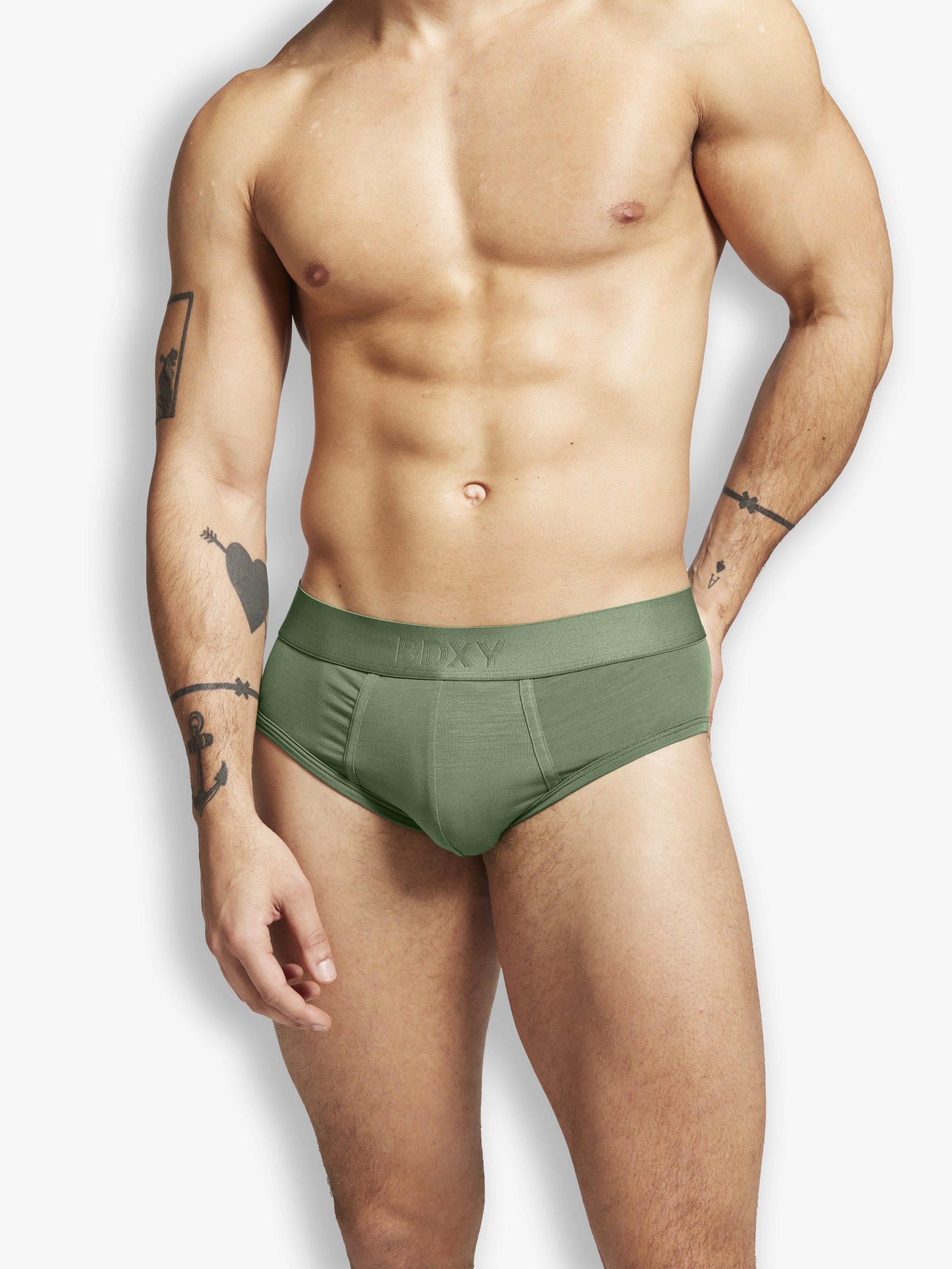 Man wearing a green underwear on a white background