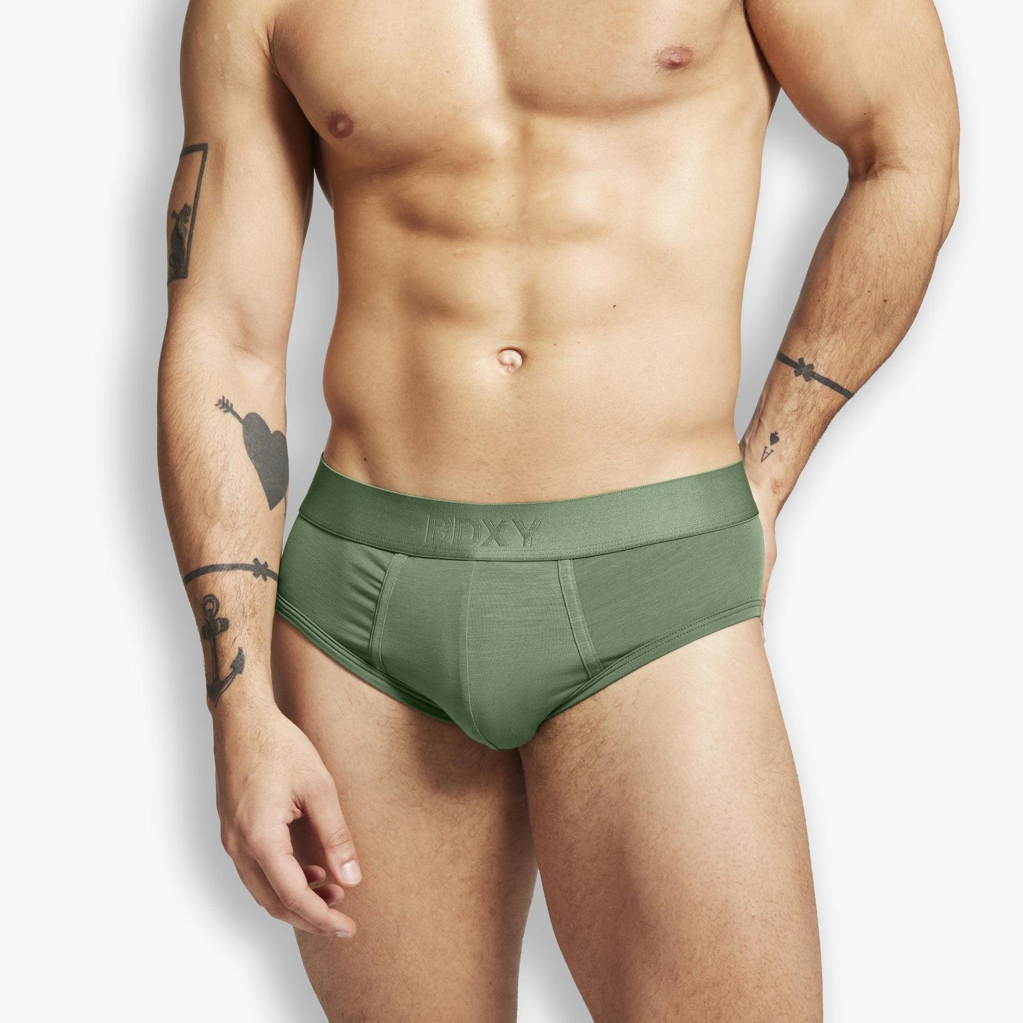 Man wearing a green underwear on a white background